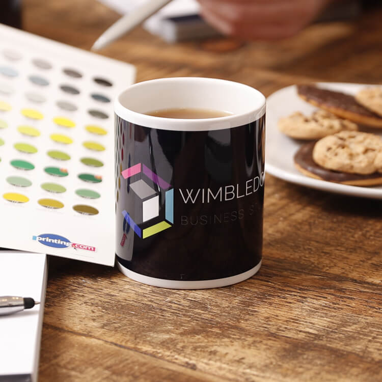 Wimbledon Business Studio Mug with coffee inside atop a table